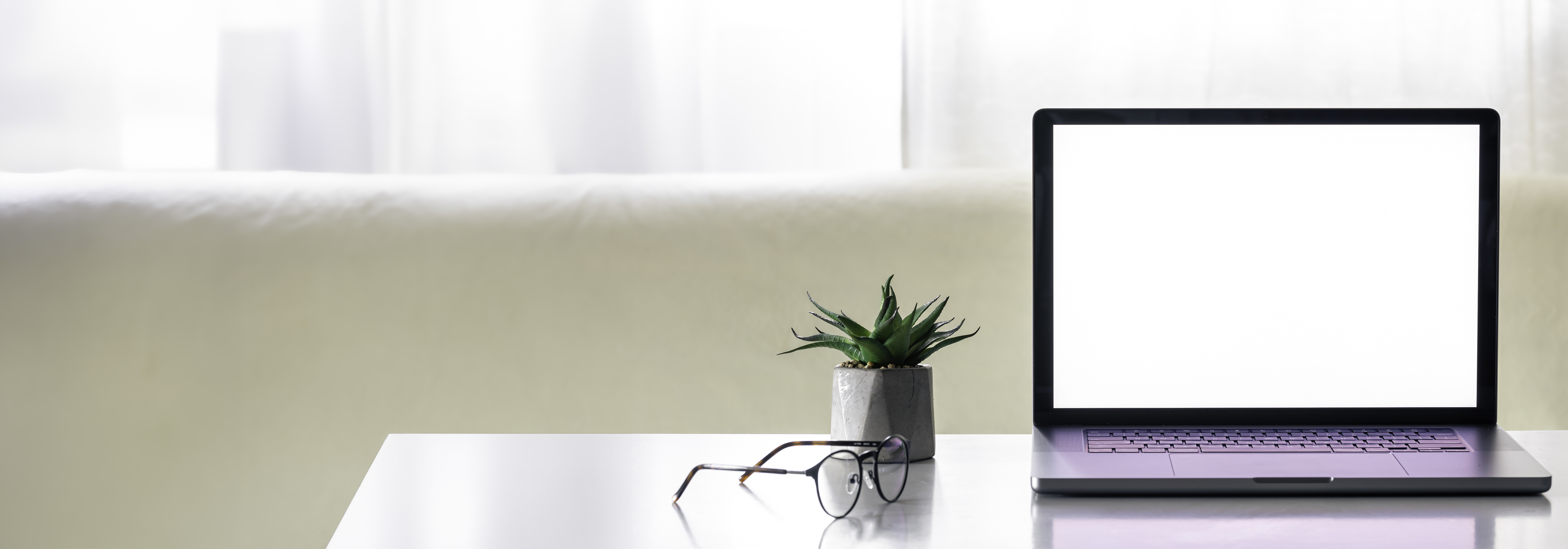 Home office desk with laptop and internet setup