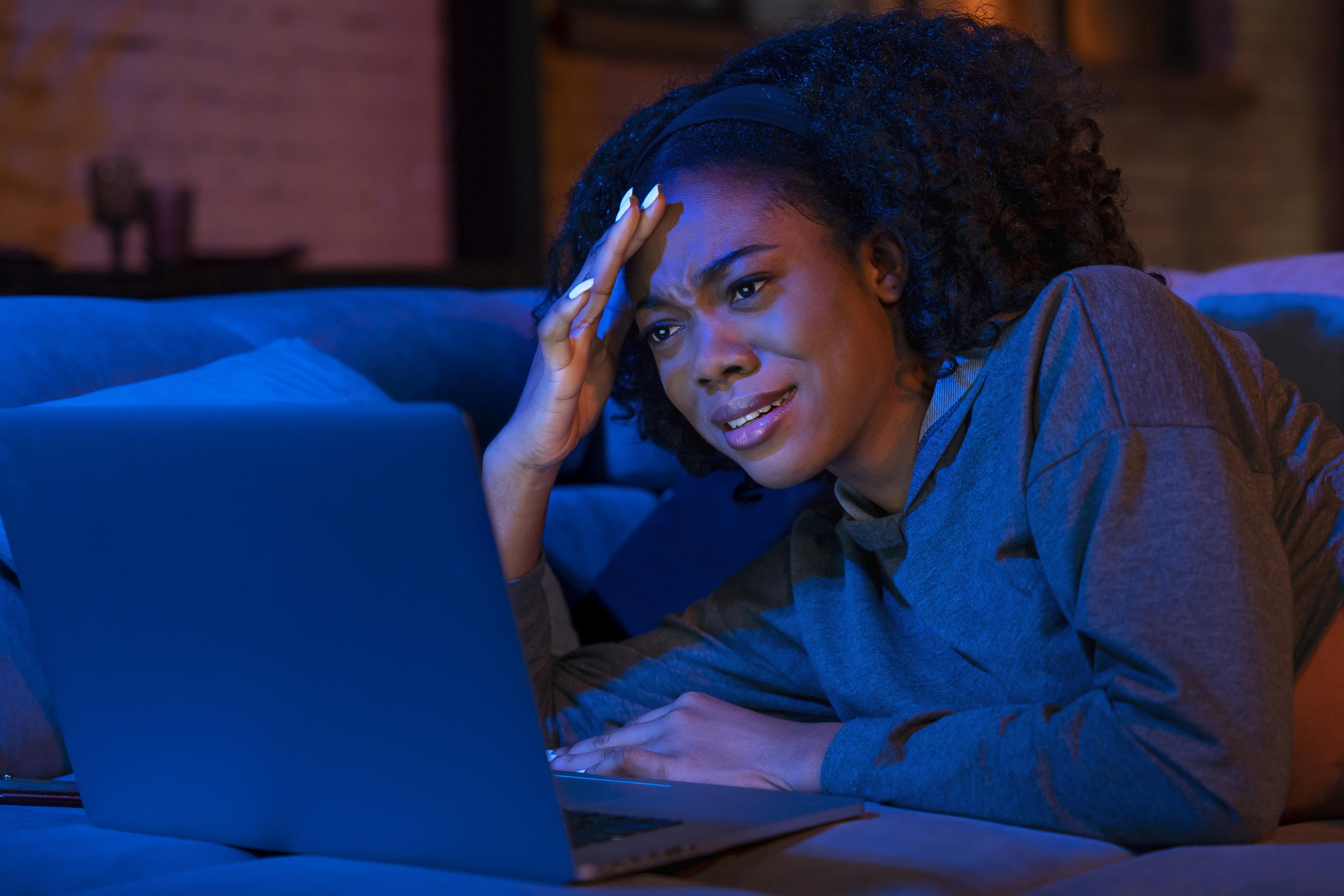 Frustrated person experiencing slow Wi-Fi at home